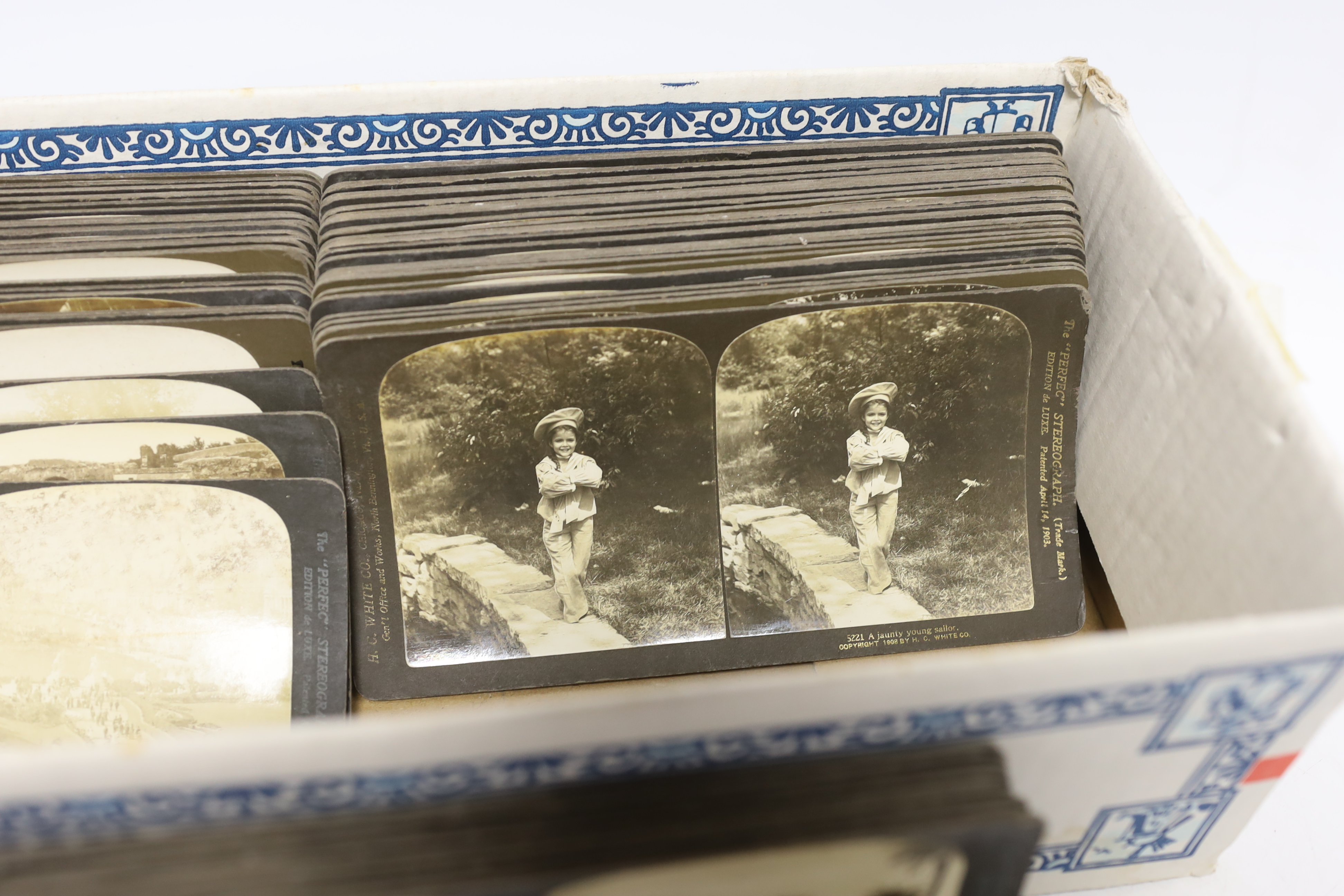 A Stereoscope viewer and slides, mostly topographical including Middle Eastern scenes